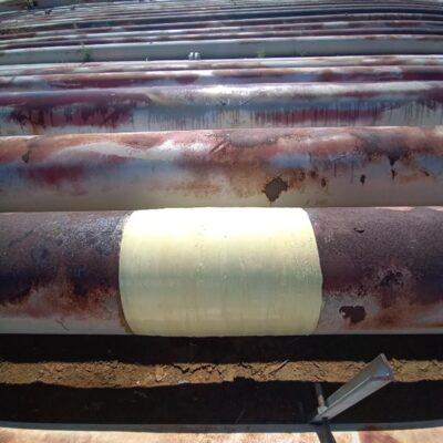 Light-colored composite repair around a pipe