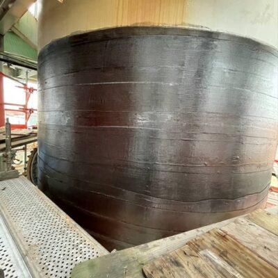 Composite wrap installed around a large industrial vessel